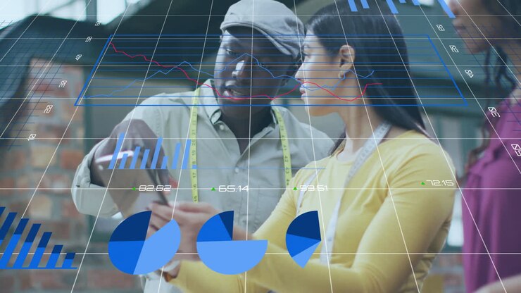 Animation of data processing and diagrams over diverse colleagues using tablet in office