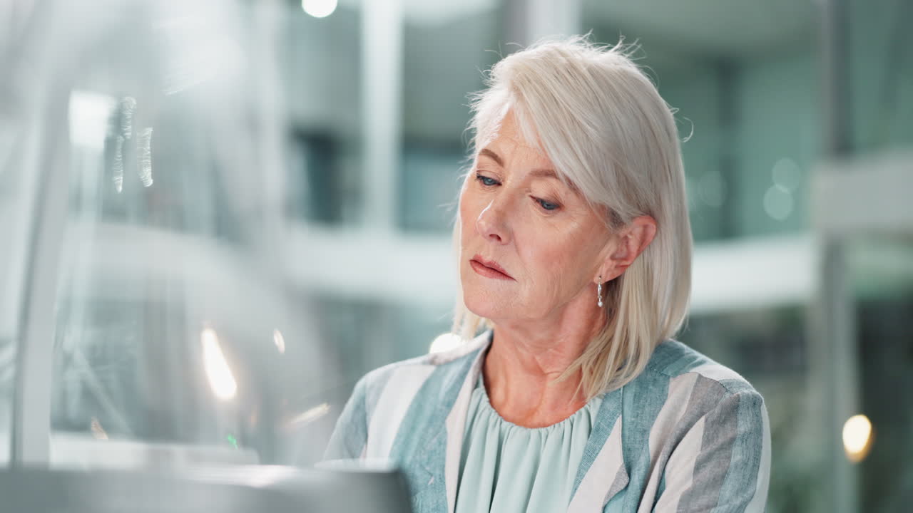 Mature Businesswoman Working in Office