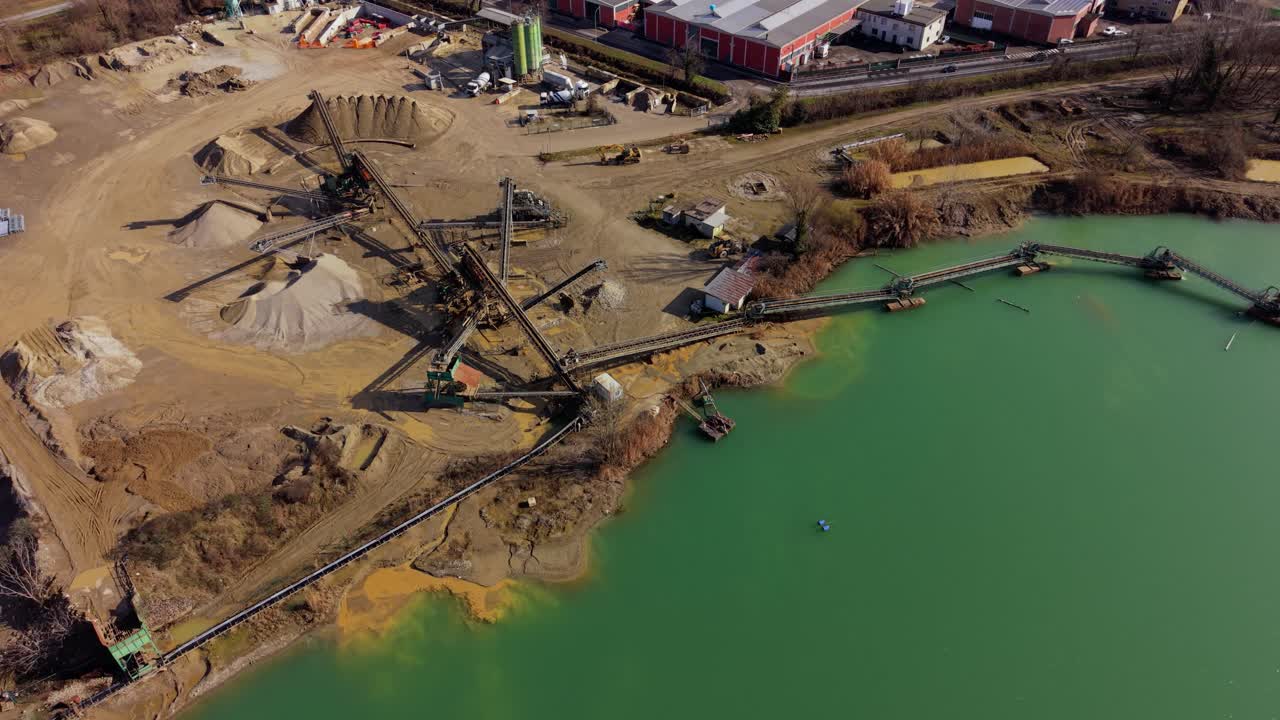 Aerial Sand Quarry With Conveyors Extracting Minerals From Lake