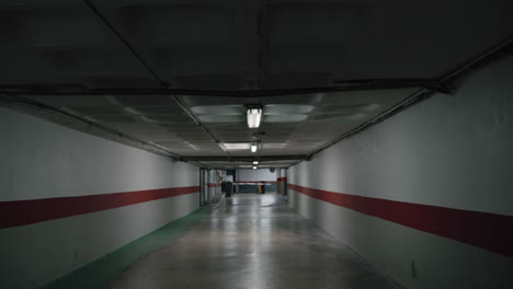 flickering light in gloomy space of underground parking lot