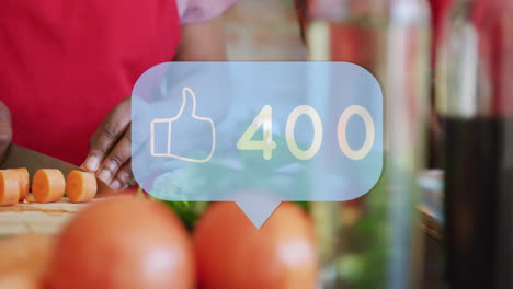 thumbs up animation with 441 likes over people chopping vegetables in kitchen