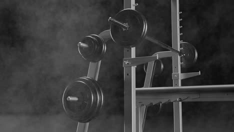 a lifting bench press set against black smoky background