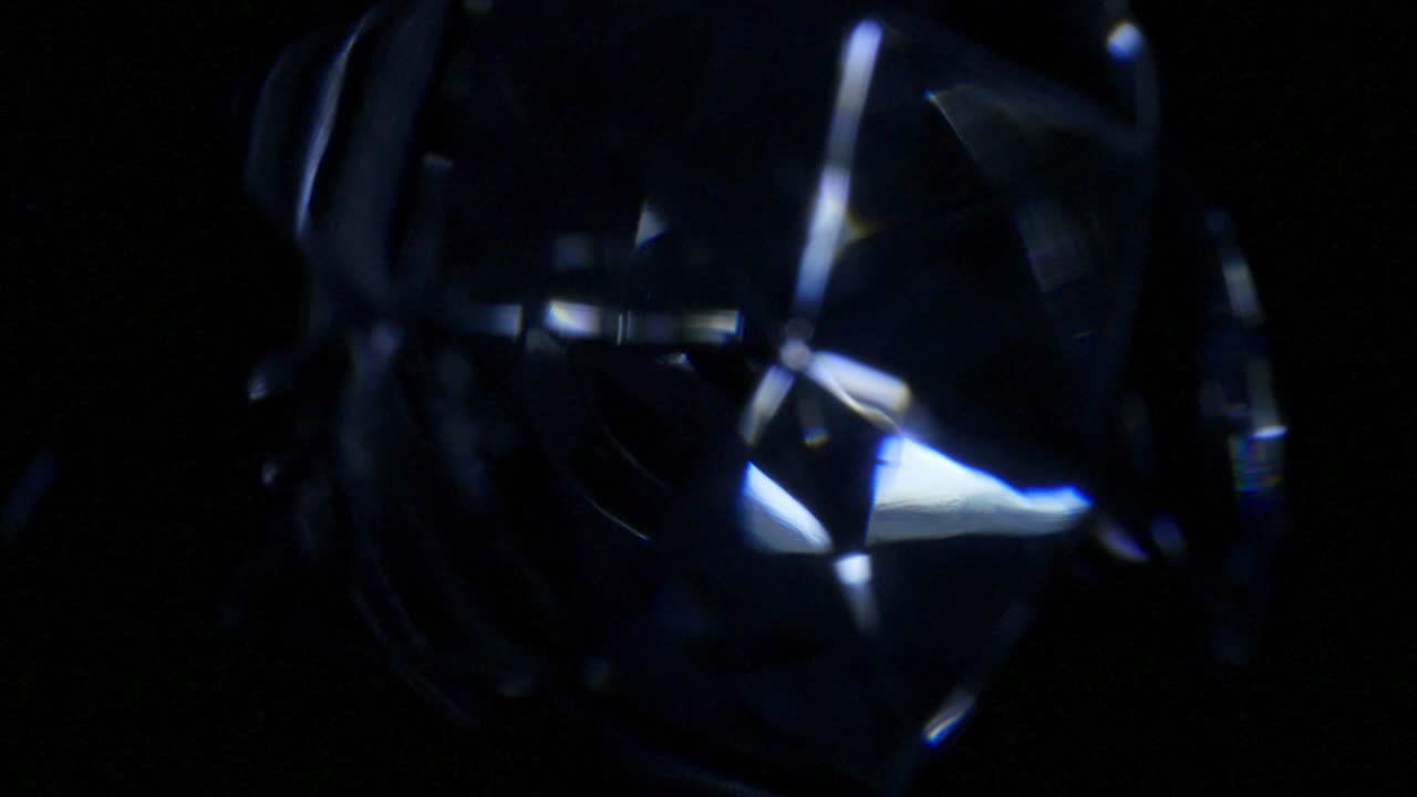 brillo de cristal oscuro bucle de fondo giratorio