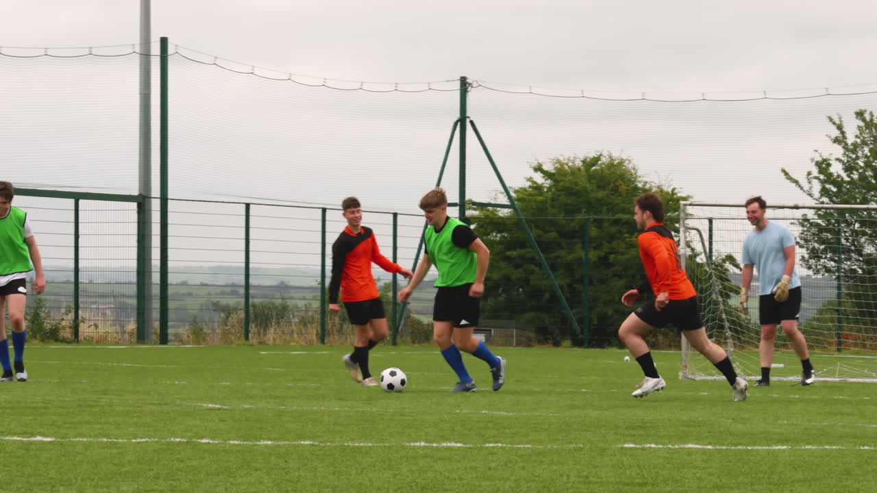Soccer players competing intensely on field during practice match, focusing on ball