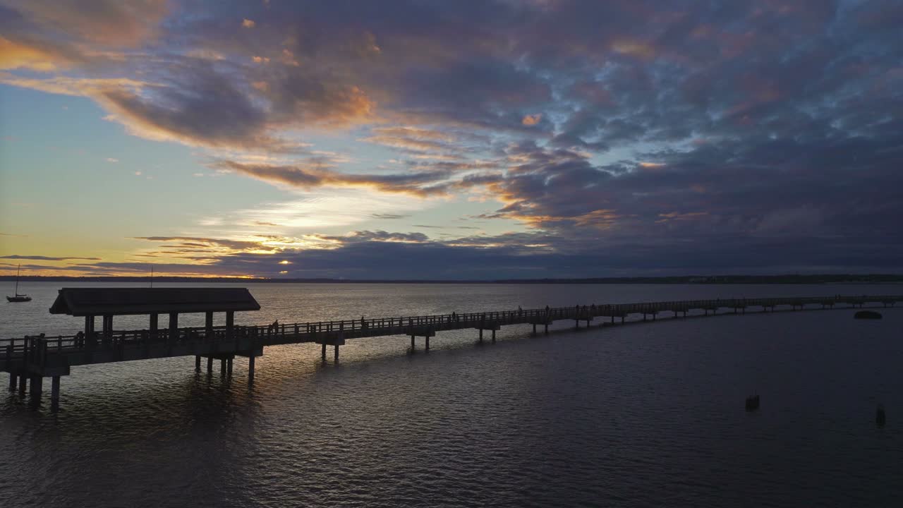 UHD 4k movie of Taylor Dock overwater bridge in Bellingham WA at evening sunset