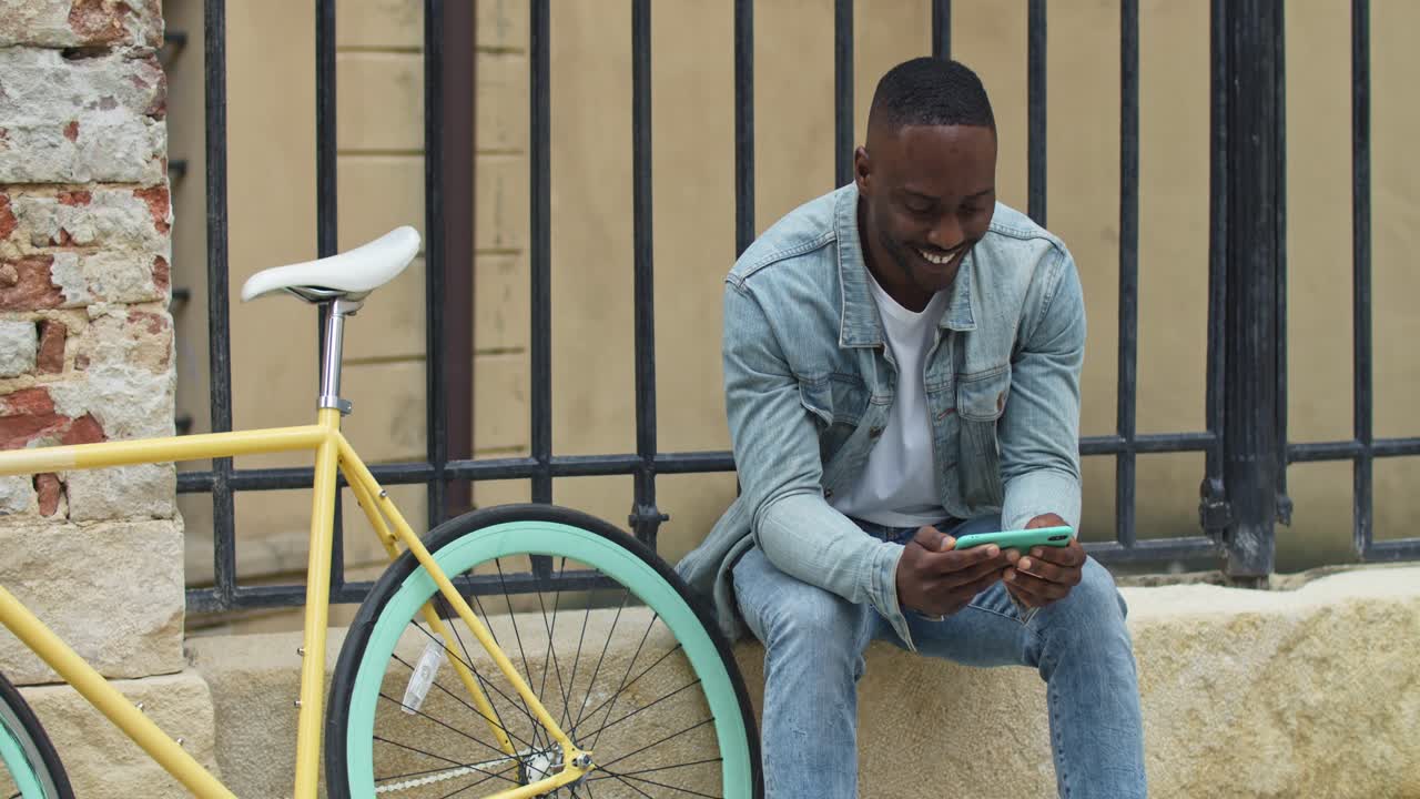 Man with Bicycle Using Phone