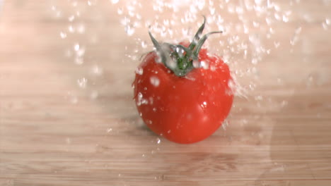 water raining on tomato in super slow motion