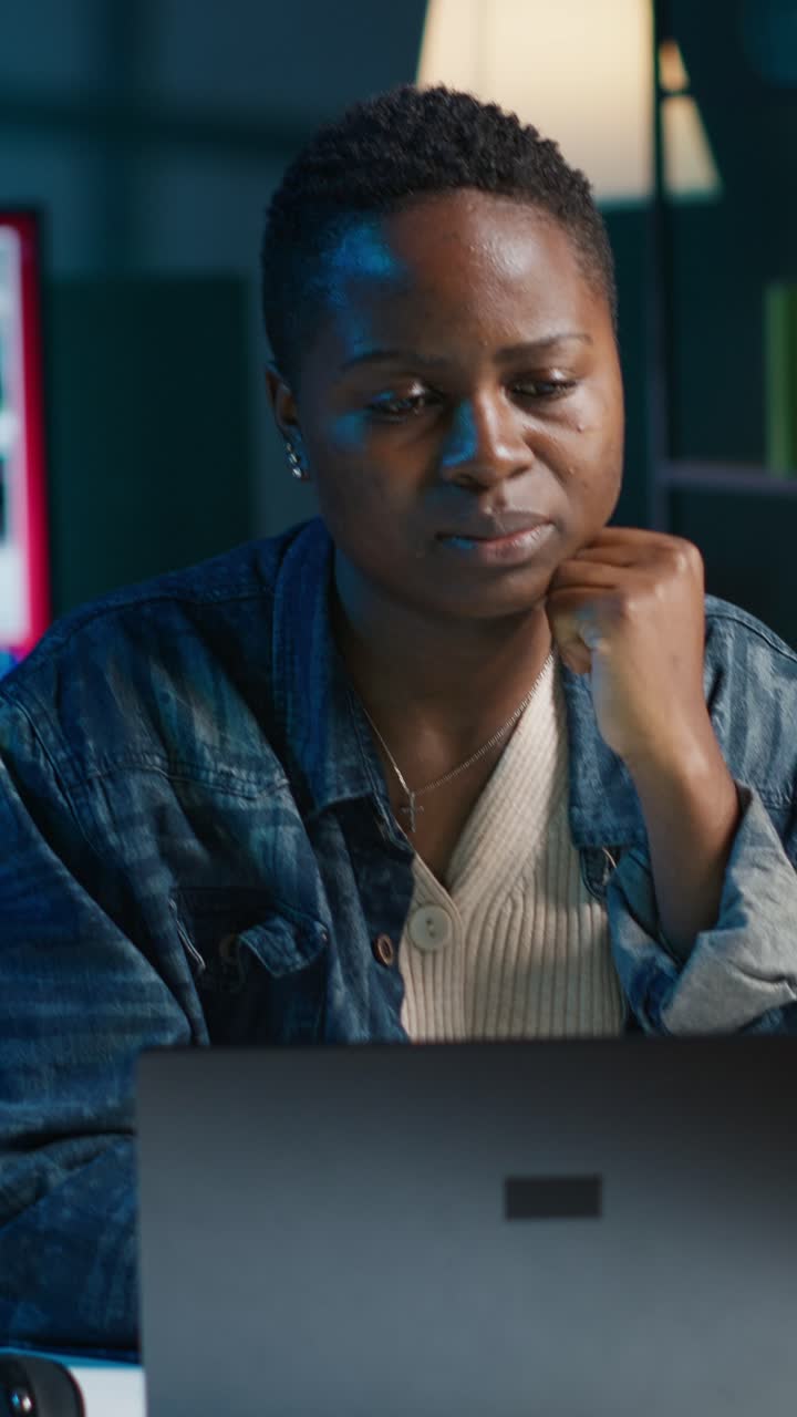 Vertical video Exhausted freelancer feeling overworked while typing on laptop