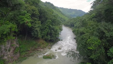 an aerial over remarkable waterfalls and green polls on the semuc champey river in guatemala 7