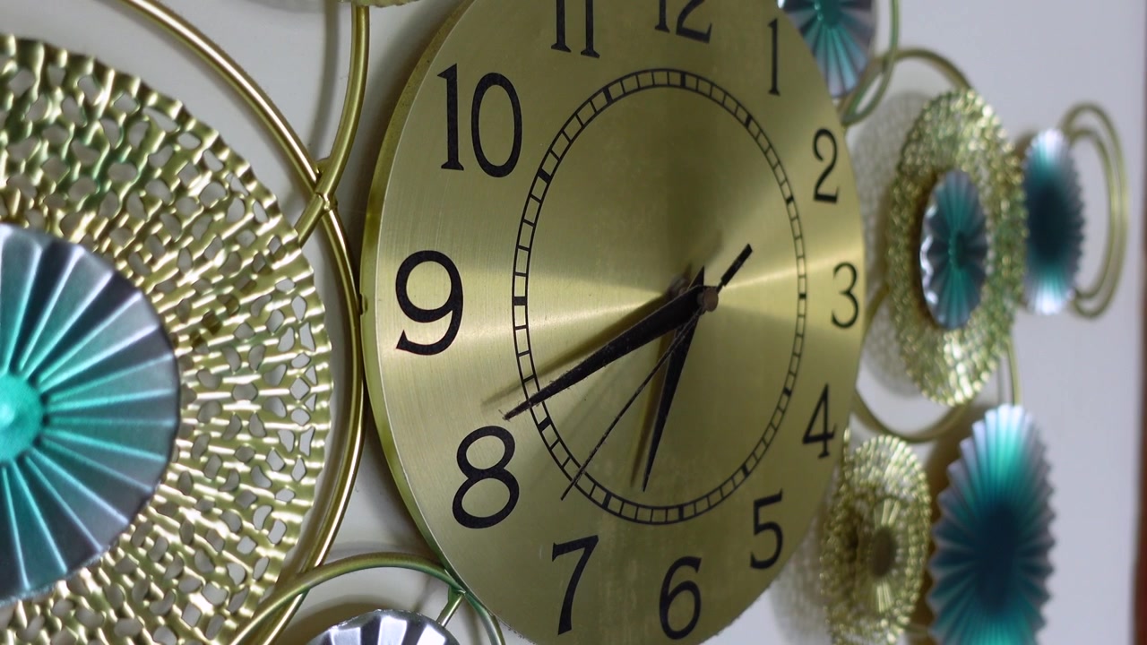 Decorative Gold Wall Clock with Intricate Metal Design