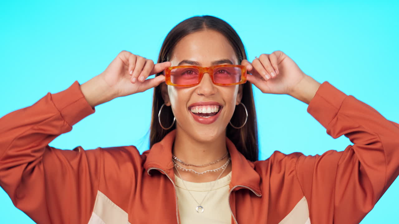 Woman, face and sunglasses for fashion in studio