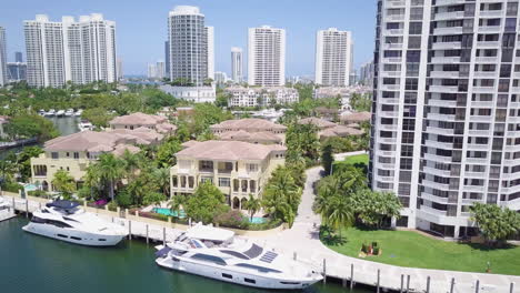 aerial shot of aventura florida marina, revealing beautiful luxury condos, yachts and homes 01