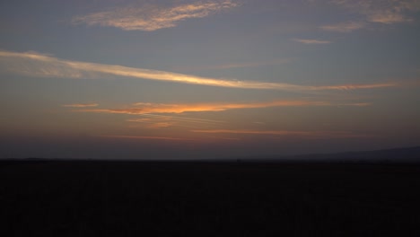 timelapse of vibrant sunset over field
