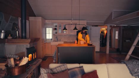 lone man in the house cleans up mess on the kitchen counter