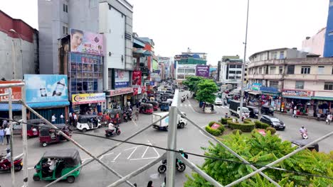 elevated view of a bustling roundabout in colombo, sri lanka, showcasing the city's vibrant traffic and commercial activity