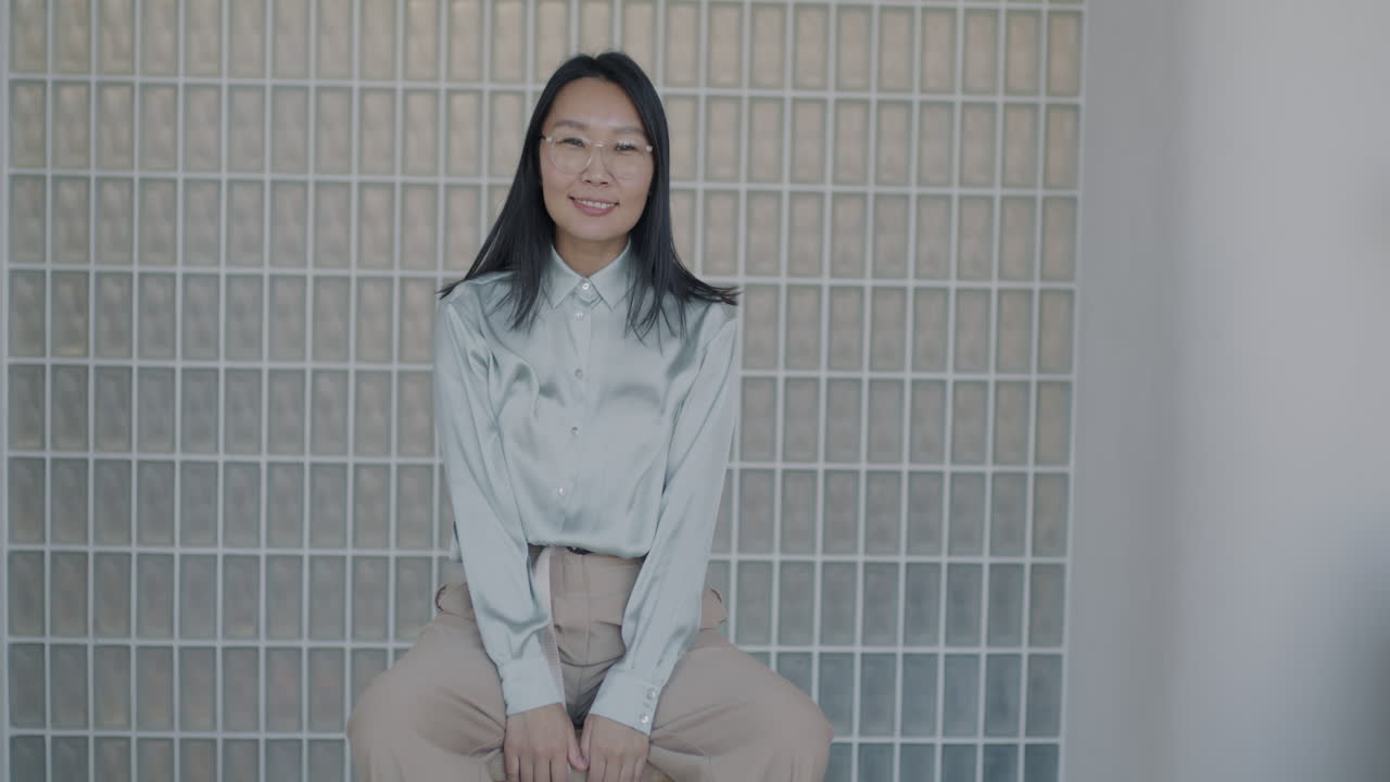 Woman Sitting and Smiling