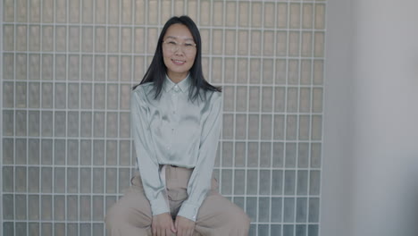 woman sitting and smiling
