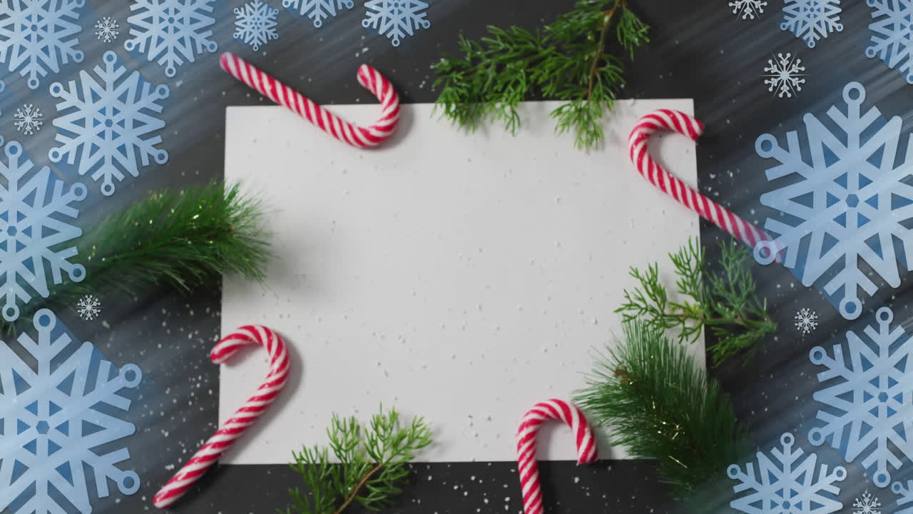 Animation of christmas decorations with copy space over snowflakes on grey background