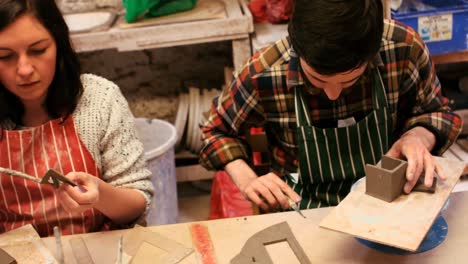 Potters-working-in-pottery-shop