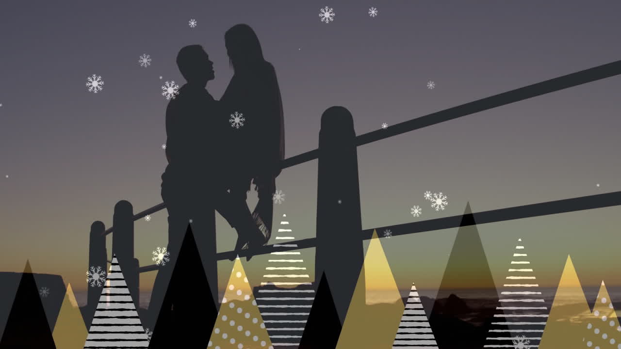 Standing by railing, silhouetted couple with snowflakes and tree animation overlay