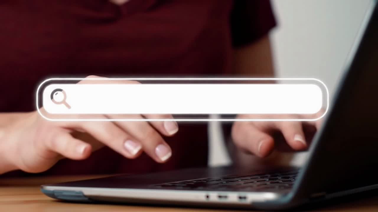Woman Typing on a Laptop to Search for Information on the Internet