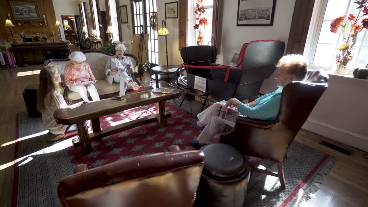 Vintage living room with elderly women and antique sleigh