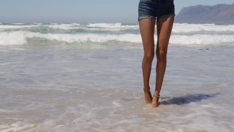 woman dancing on beach in the sunshine 4k