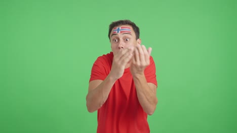 man cheering for norway, angry with the decision of referee