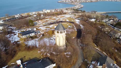 aerial view of tower in fort revere park in massachusetts with allerton city in the background