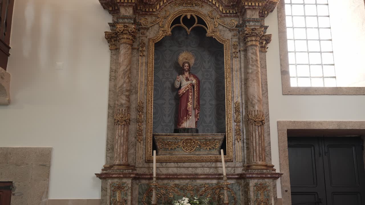 Ornate altar with religious statue in historical church interior, soft daylight