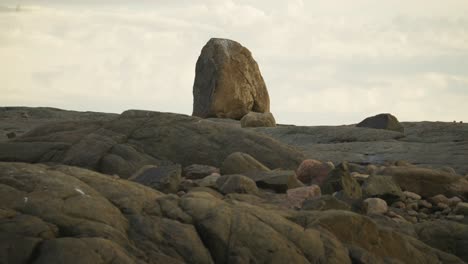 large stone standing high in a rocky tundra