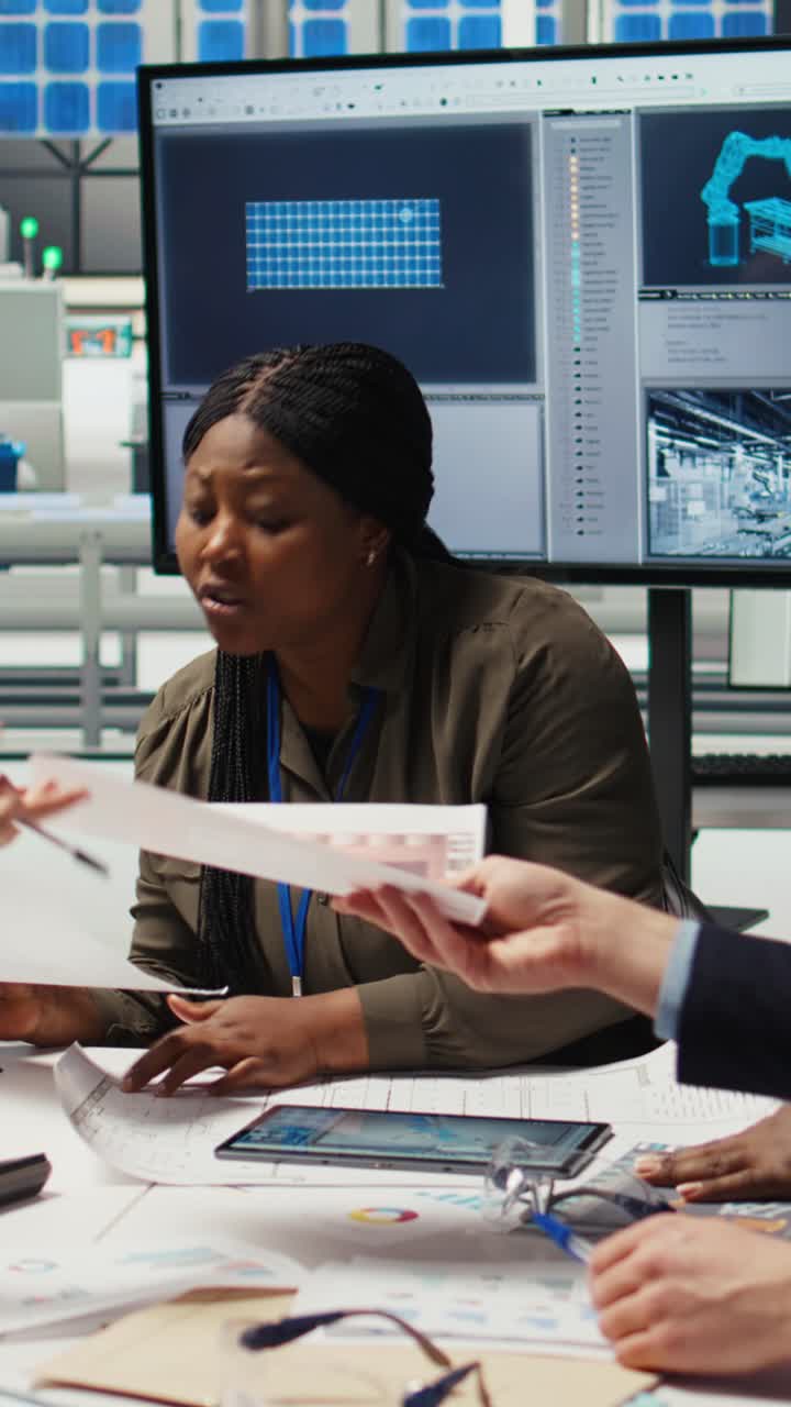 Vertical video Solar panels plant shareholders chat about company growth and market expansion