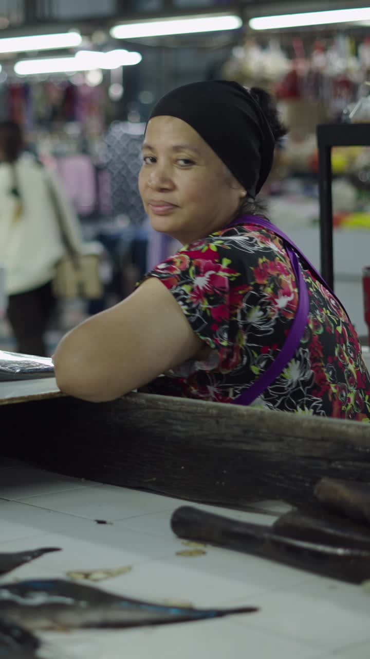 A woman at a market counter