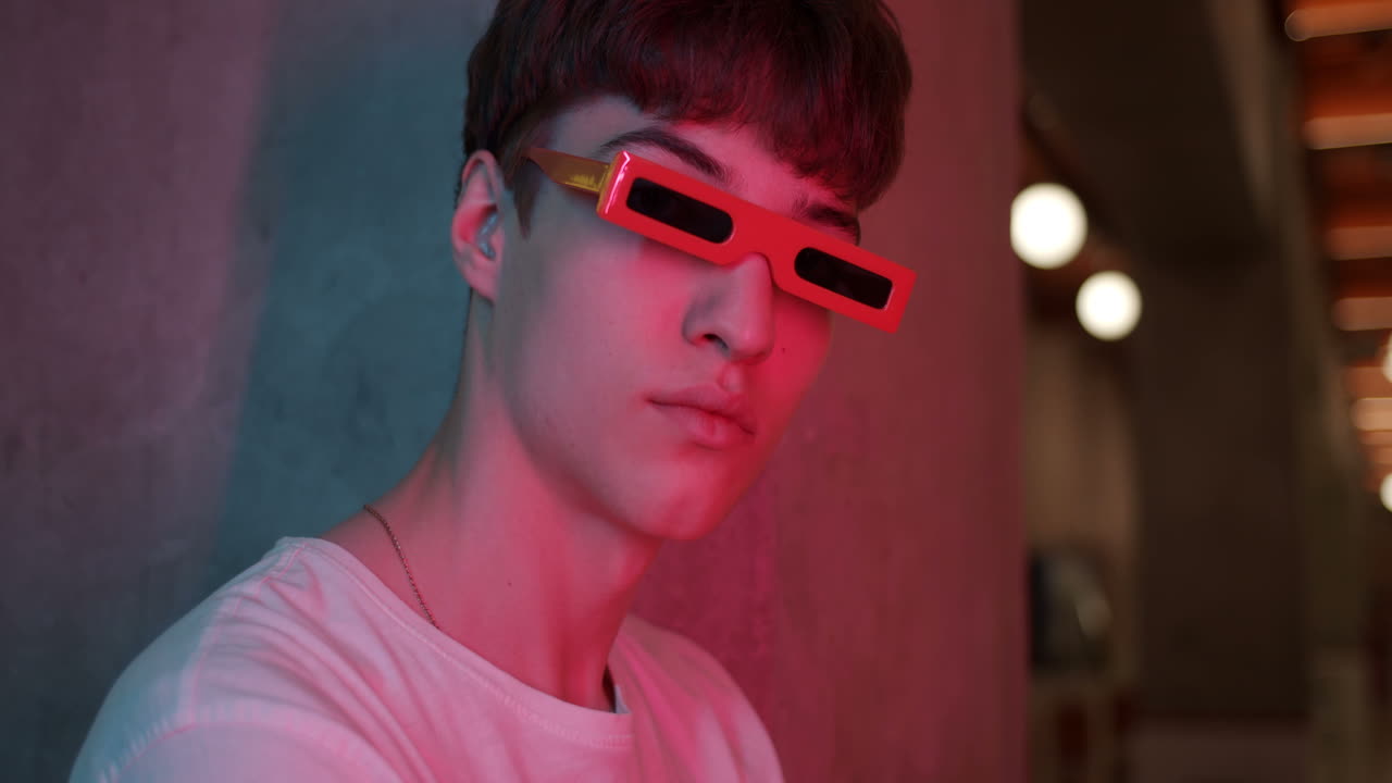 Man with red futuristic sunglasses