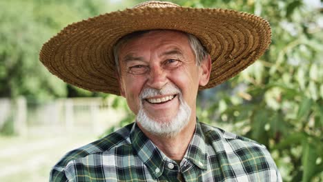 close up video portrait of happy farmer in a hat