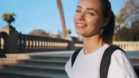 Camera-zooming-on-soccer-woman-smiling-at-camera-in-the-street.