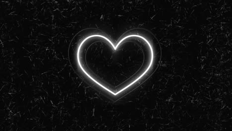 animación de corazones de neón coloridos sobre un fondo negro