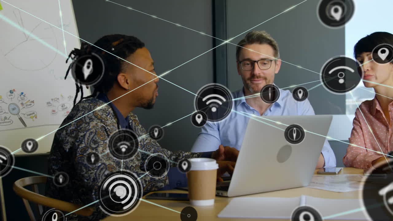 Animation of network of digital icons over diverse colleagues discussing together at office