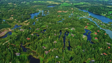 waterfront homes and cabins in a planned, countryside community - aerial descent