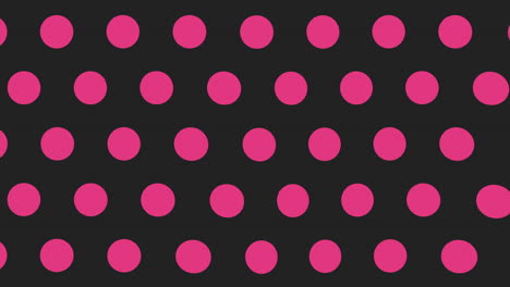 pink and black polka dot pattern on a black background