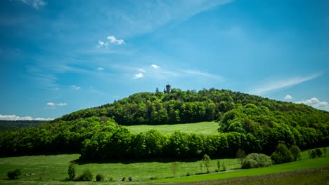 timelapse at meiningen landsberg castle in thuringian forest with blue sky and passing clouds