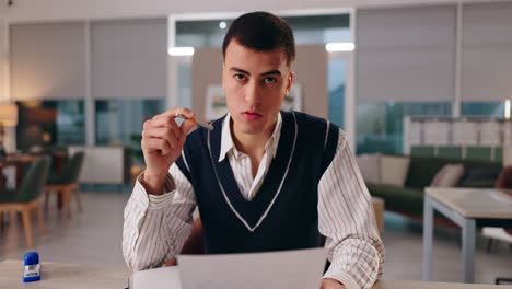 man working at desk in office