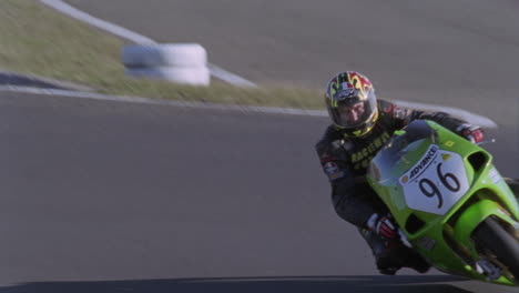 a motorcyclist races around a track 2