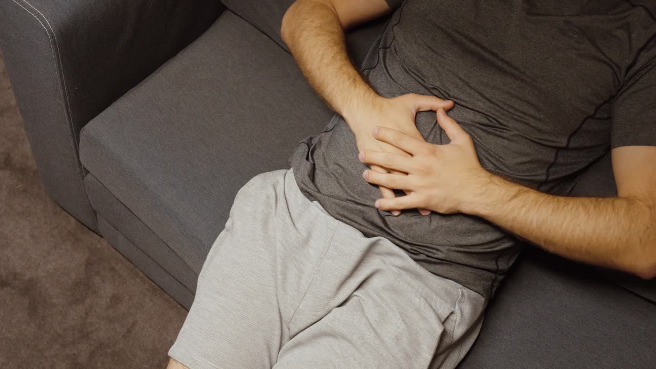 Concept of Bloating, Fullness, Digestion Issues or Abdominal Discomfort in Casual Home Setting