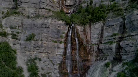 bridal veil falls waterfall cascading on utah mountains in provo canyon, aerial