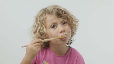 small girl brushing her teeth