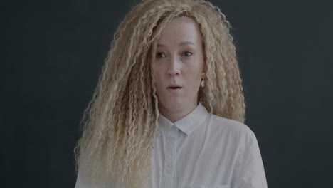 woman with curly blonde hair, portrait photos