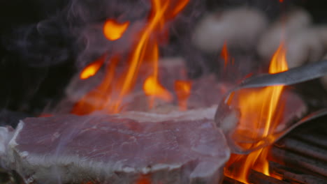 chef tenderising sirloin steak by slapping on bbq flame grill in summer ready for eating at family celebration gathering 4k