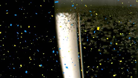 animatie van confetti dat valt en een glas champagne op een zwarte achtergrond