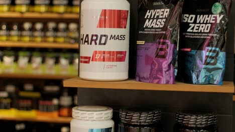 sport nutrition store interior with large choice of nutritional supplements.